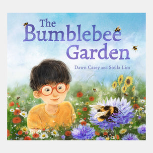 Book cover of 'The Bumblebee Garden' with a boy in a garden surrounded by flowers and bees.