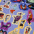 Halloween-themed stickers with various characters on a purple background