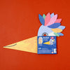 Colorful paper craft of a bird with a 'BE WILD!' kit on an orange background
