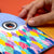 Colorful children's book with a hand turning a page