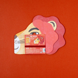Cardboard cutout of a lion head with a small box labeled 'Be Wild!' on an orange background