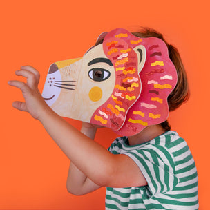 Person wearing a colorful animal mask against an orange background