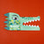 Londji Paper mask crocodile design on an orange background