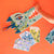 Colorful paper craft of a crocodile on an orange background