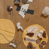 Grapat Avent Calendar 2025 Textile samples and materials on a wooden surface