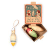 Wooden Christmas ornaments in a decorative box with 'Winter Sparkles' text on a white background