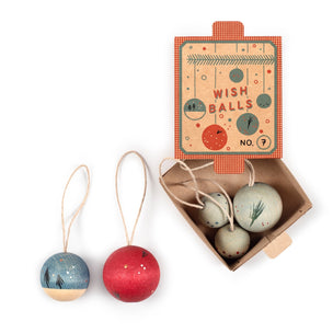 Wish balls with a cardboard box on a white background