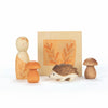 Set of wooden forest-themed figurines including a mushroom, hedgehog, and two smaller figures on a white background.