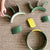 Green and yellow children's playset on a textured surface