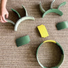Green and yellow children's playset on a textured surface