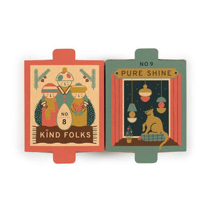 Two vintage-style illustrated matchboxes shown side by side on a plain white background. The left matchbox is coral red with a cream illustration and the text 'KIND Folks' at the bottom.