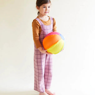 girl holding a silk rainbow ball