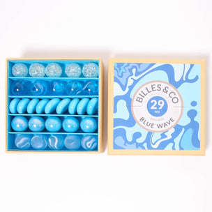 A great selection of various blue glass marbles and pebbles in a themed box | © Conscious Craft