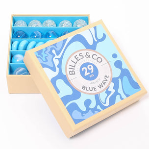 A great selection of 25 blue glass marbles and pebbles in a themed box | © Conscious Craft