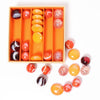 A great selection of various orange glass marbles and pebbles in a orange themed box | © Conscious Craft