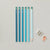 Set of blue pencils with a sharpener on a light gray background