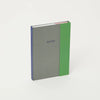 Notebook with green and gray design on a white background
