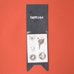Londji Black sleeve with tattoo designs on a red background