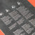 Instructions or guidelines printed on a black surface with white text and icons.