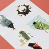 Set of Halloween-themed temporary tattoos on a white card with a red background