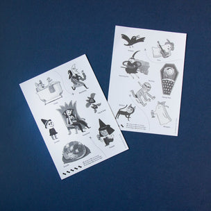 Two sheets of Halloween-themed temporary tattoos on a blue background