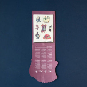 Purple decorative item with illustrations and text on a dark blue background