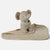 A beige plush elephant toy sitting on a matching patterned fabric blanket against a clean white background.