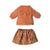 A two-piece children's knit outfit set featuring a long-sleeve textured knit top in terracotta orange and a matching patterned skirt in a warm brown and beige floral print, laid flat on a white background.