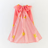 Sarah's Silks Pink cape with yellow star patterns on a white background