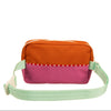 Multicolored bag with orange top section, pink middle section, and green strap on a white background