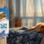 Door handle with a shark-themed Eugy door hanger labeled 'All Clear! Shark's Naptime' in a bedroom setting.