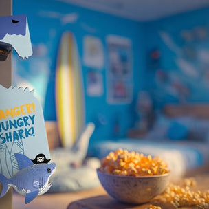 Shark door hanger with 'Hungry Shark!' text in a room setting.