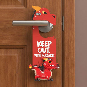 A red dragon-shaped door hanger with the words 'KEEP OUT. FIRE HAZARD.