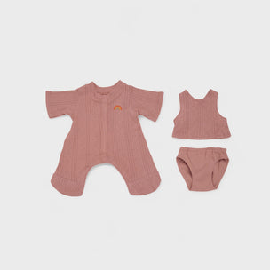 Baby outfit set with romper, tank top, and diaper on a light gray background