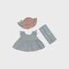Baby dress, hat, and blanket set on a light gray background