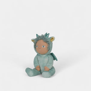 Toy figure of a child in a dragon costume on a white background