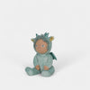 Toy figure of a child in a dragon costume on a white background