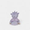 Purple plush toy with a bow on a white background