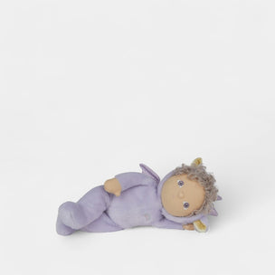 Toy figure of a baby in a purple outfit on a white background