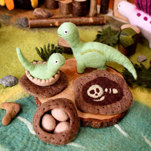 felt dino on wooden disk 