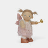 Fairy doll with pink wings and a golden wand on a white background