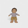 Toy doll with striped shirt and shorts on a white background