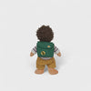 Doll with a green backpack on a white background