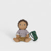 Toy doll with a striped shirt and backpack on a white background