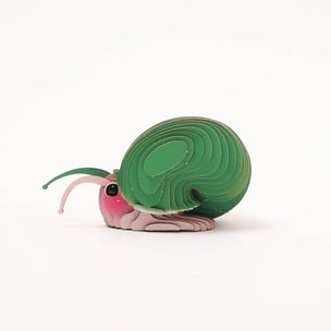 A 3D cardboard DIY model of a snail, constructed with layered wooden slats, featuring a brown body, green head and ear, and pink and white stripes on the face, set against a plain white background.