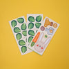 Three sheets of stickers with green leaf patterns, a carrot, and a rabbit on a yellow background.