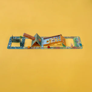 Londji Toy set with various pieces on a yellow background