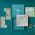 A children's wooden board game set titled 'best friends' arranged on a teal background. The set includes a teal game board with a pink frame, illustrated cards, small wooden houses, and several small player pieces.