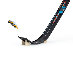 Toy car track set with a curved track and toy cars on a white background