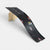 Black toy race track with wooden support on a white background
